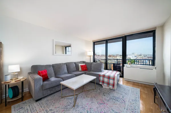 a living room with furniture and a large window