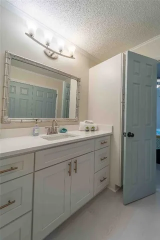 a bathroom with double sink and a mirror