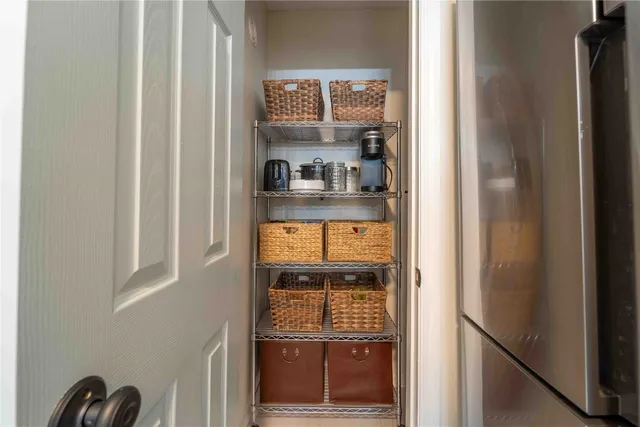 a view of open kitchen with wooden floor and a window
