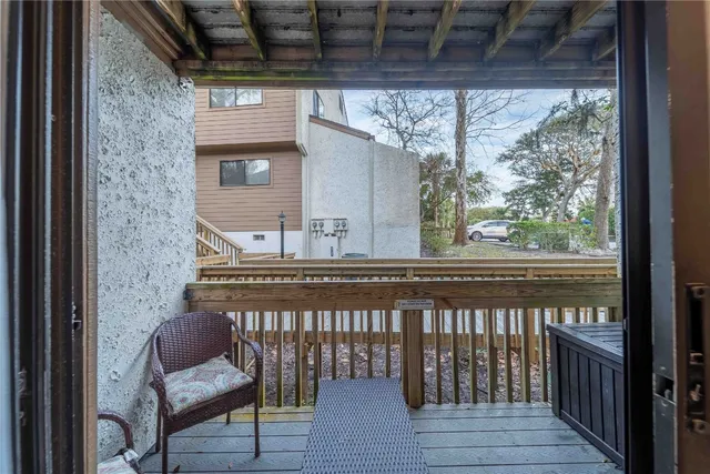 a view of a balcony with chairs