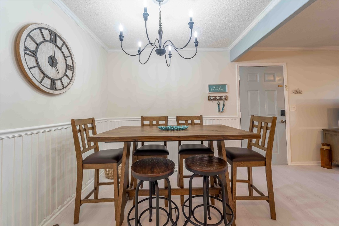 2562 Forest Ridge Drive, Unit P2 Fernandina Beach, FL 32034 - Photo 7 of 23 a view of a dining room with furniture and a chandelier