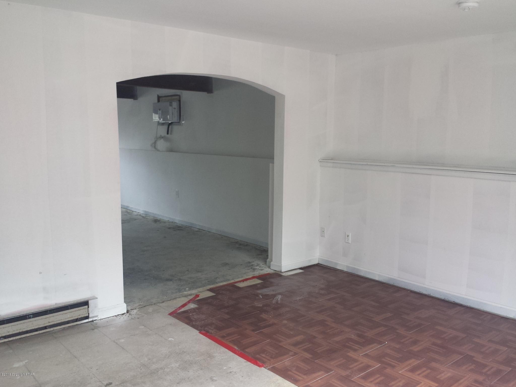 5766 Decker Road Bushkill, PA 18324 - Photo 12 of 13 an empty room with a door