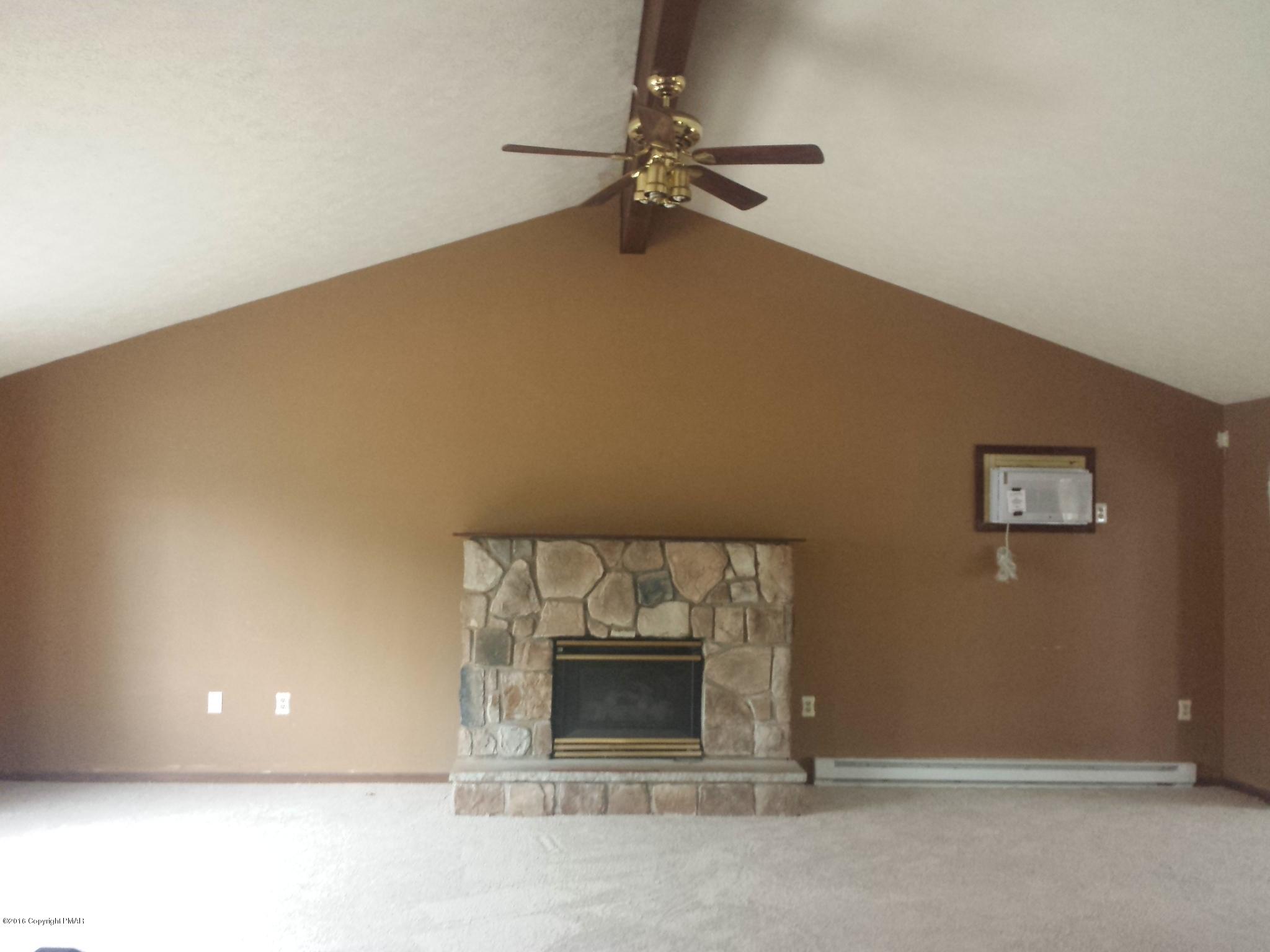 5766 Decker Road Bushkill, PA 18324 - Photo 4 of 13 a view of a livingroom with a fireplace
