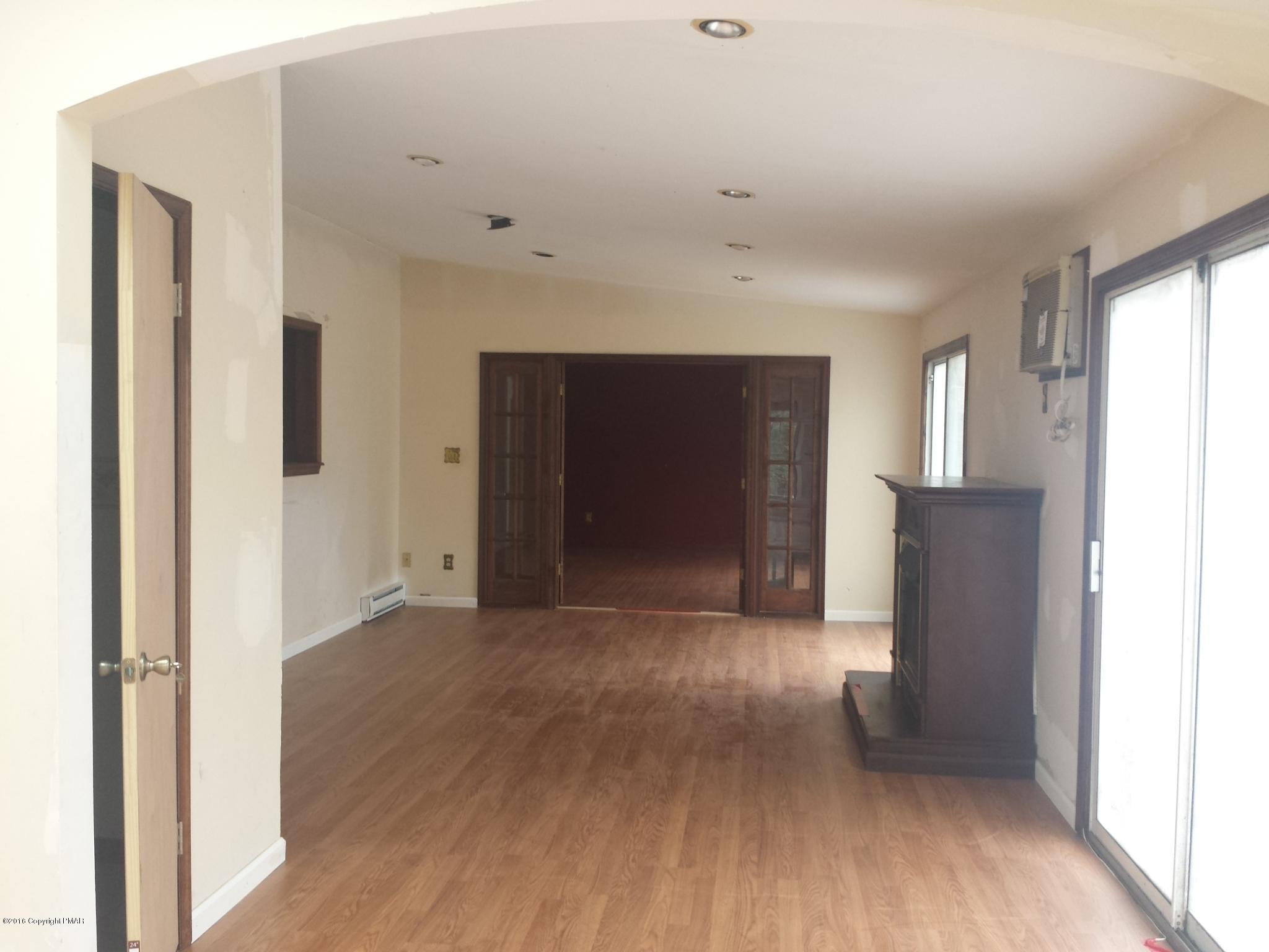 5766 Decker Road Bushkill, PA 18324 - Photo 7 of 13 a view of empty room with wooden floor