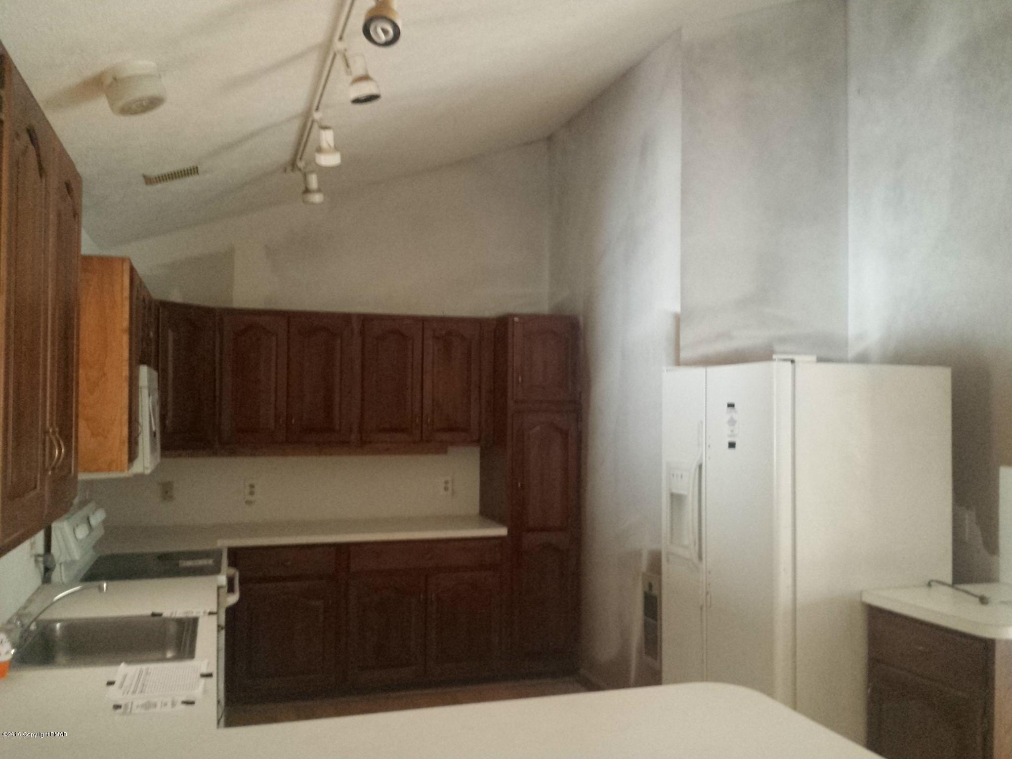 5766 Decker Road Bushkill, PA 18324 - Photo 8 of 13 a kitchen with a sink and cabinets