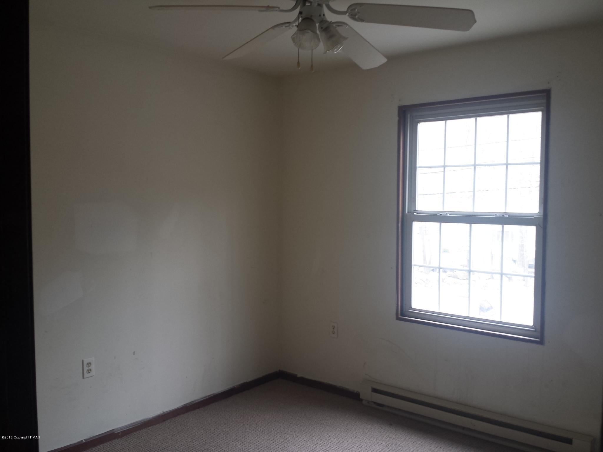 5766 Decker Road Bushkill, PA 18324 - Photo 10 of 13 an empty room with a window