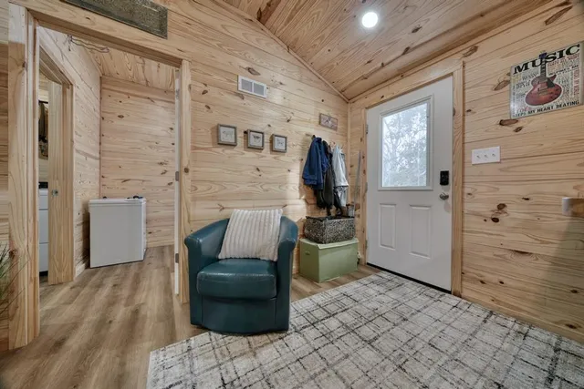 a kitchen with refrigerator and window