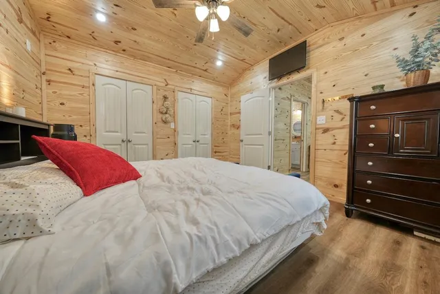 a bedroom with a bed and a chair