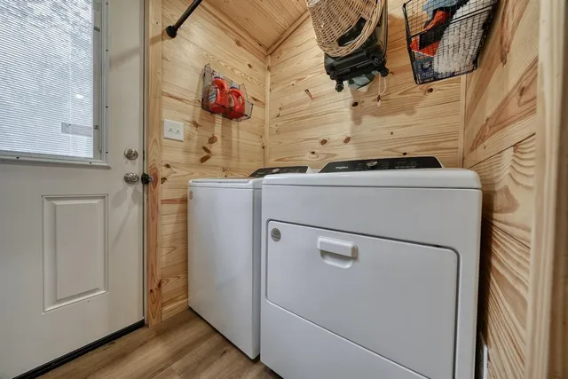 a backyard of a house with table and chairs