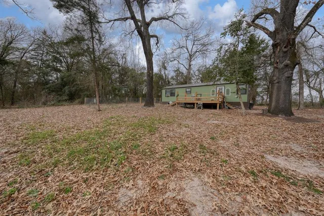 a backyard of a house with lots of green space