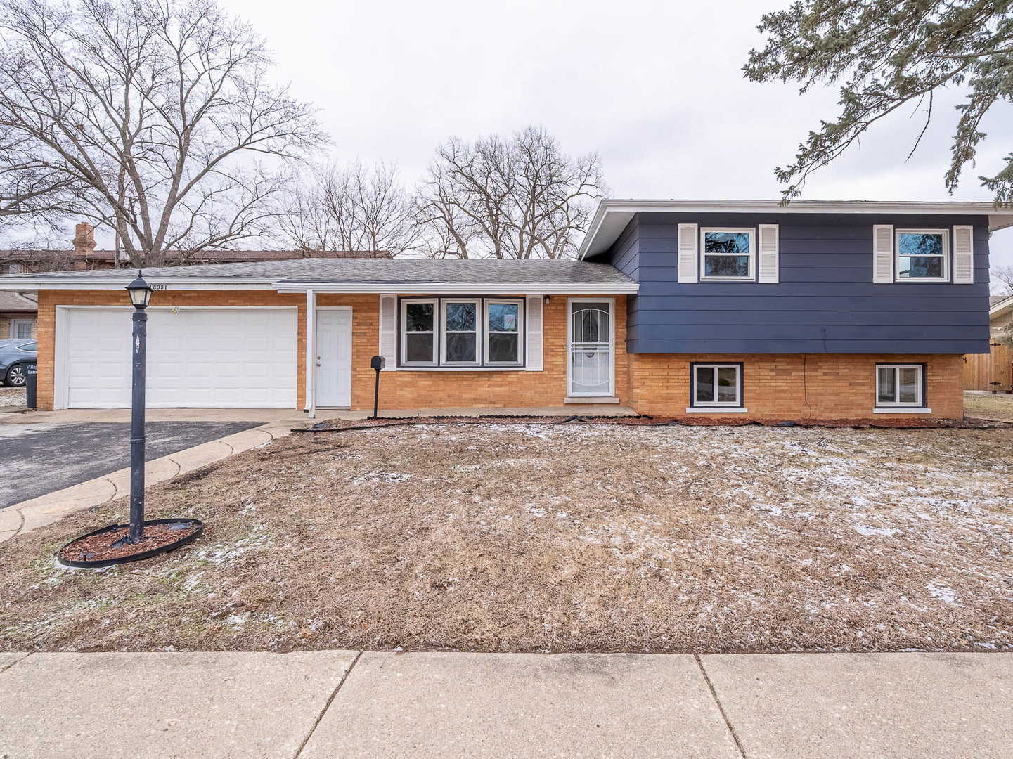 18331 Hickory Street Lansing, IL 60438 - Photo 1 of 12 a front view of a house with garden