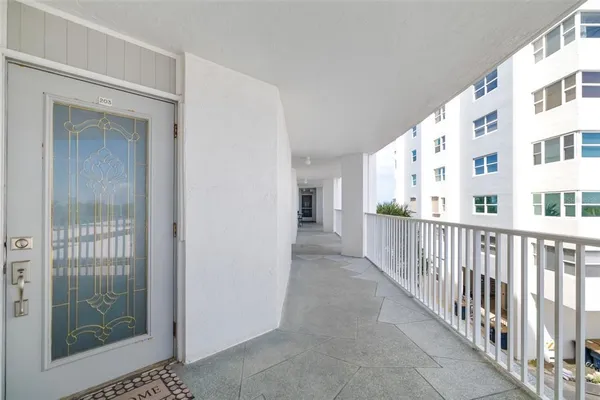 a view of a hallway with windows
