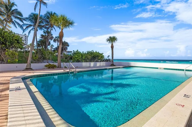 a view of a swimming pool with a patio
