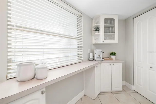 a bathroom with a sink a vanity and a window