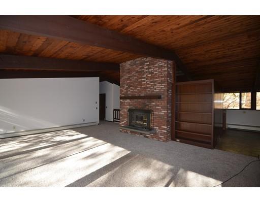 24 Craggs Road Harvard, MA 01451 - Photo 5 of 20 a view of an empty room with a fireplace