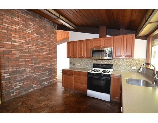 24 Craggs Road Harvard, MA 01451 - Photo 7 of 20 a kitchen with stainless steel appliances a stove a sink and a microwave