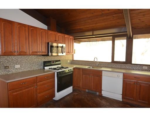 24 Craggs Road Harvard, MA 01451 - Photo 8 of 20 a kitchen with stainless steel appliances granite countertop a stove a sink and a microwave