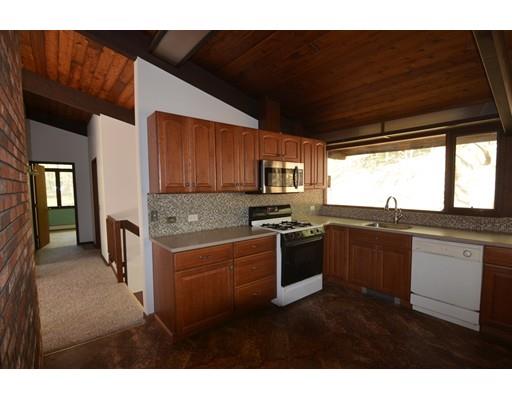 24 Craggs Road Harvard, MA 01451 - Photo 9 of 20 a open kitchen with kitchen island granite countertop a refrigerator stove top oven and sink