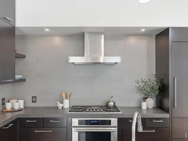 a kitchen with a stove and cabinets