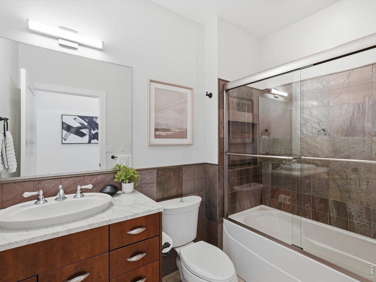 2336 Spruce Street, Unit E Boulder, CO 80302 - Photo 20 of 48 a bathroom with a granite countertop sink a toilet and shower
