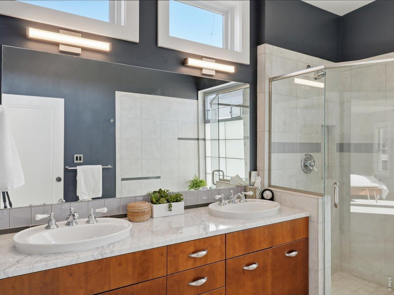 2336 Spruce Street, Unit E Boulder, CO 80302 - Photo 26 of 48 a bathroom with a granite countertop sink and a mirror