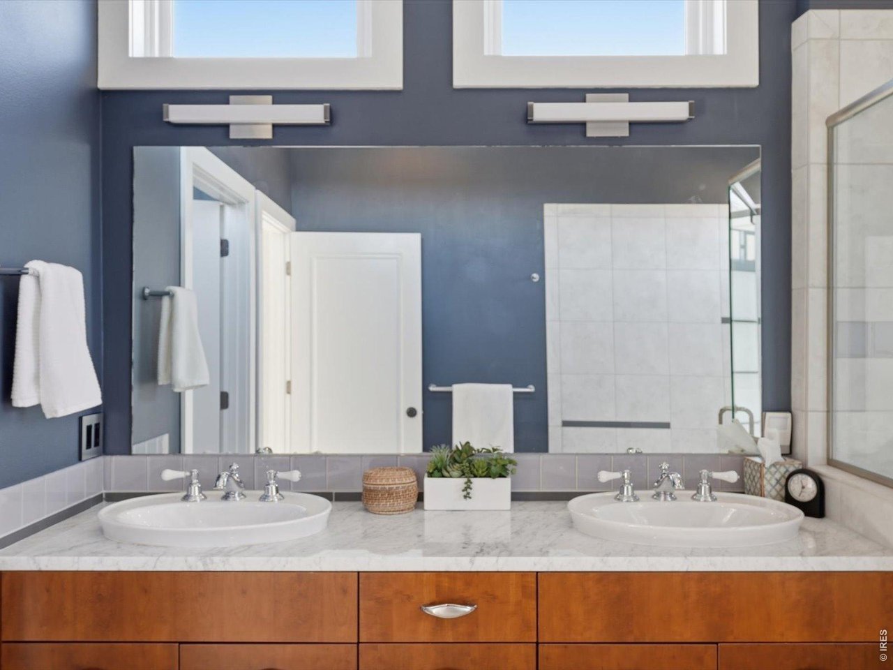 2336 Spruce Street, Unit E Boulder, CO 80302 - Photo 28 of 48 a bathroom with double vanity sinks granite vanity and a mirror