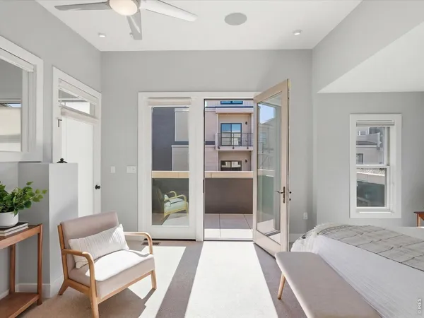 a bedroom with furniture and a window
