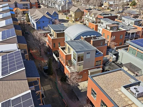 an aerial view of a house with a roof deck