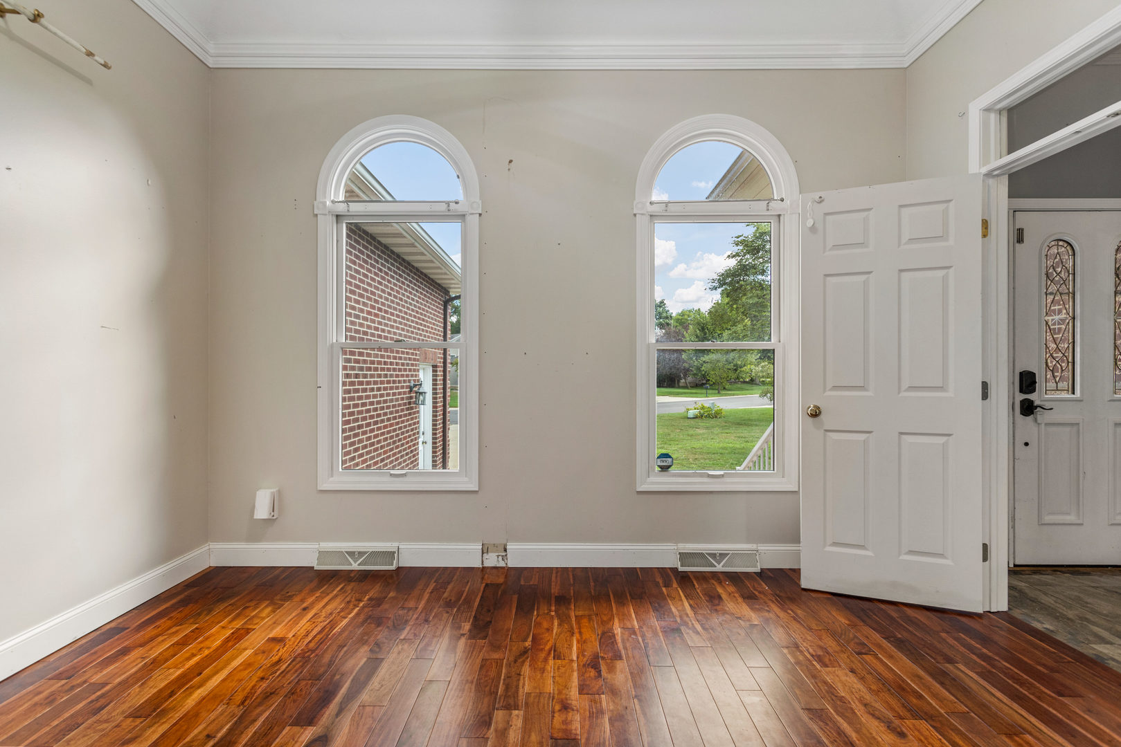 1511 River Bluff Court Mahomet, IL 61853 - Photo 14 of 50 an empty room with wooden floor windows and a mirror