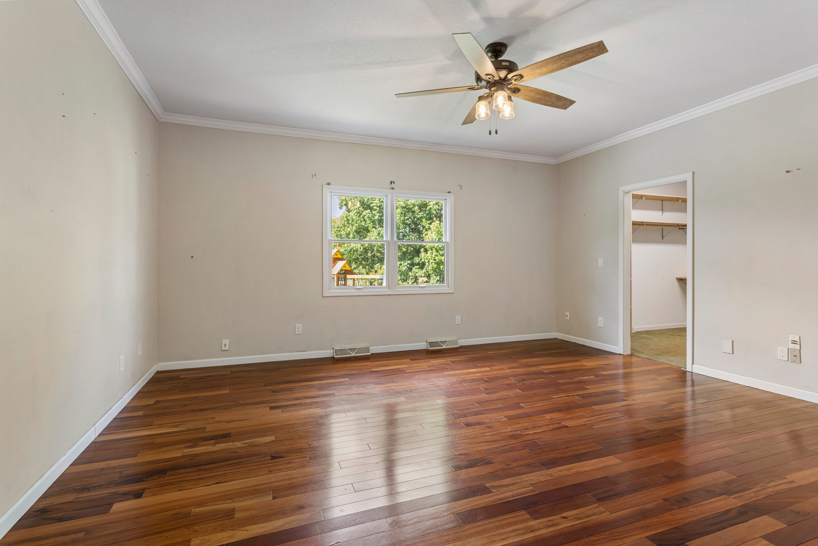 1511 River Bluff Court Mahomet, IL 61853 - Photo 15 of 50 an empty room with wooden floor and windows