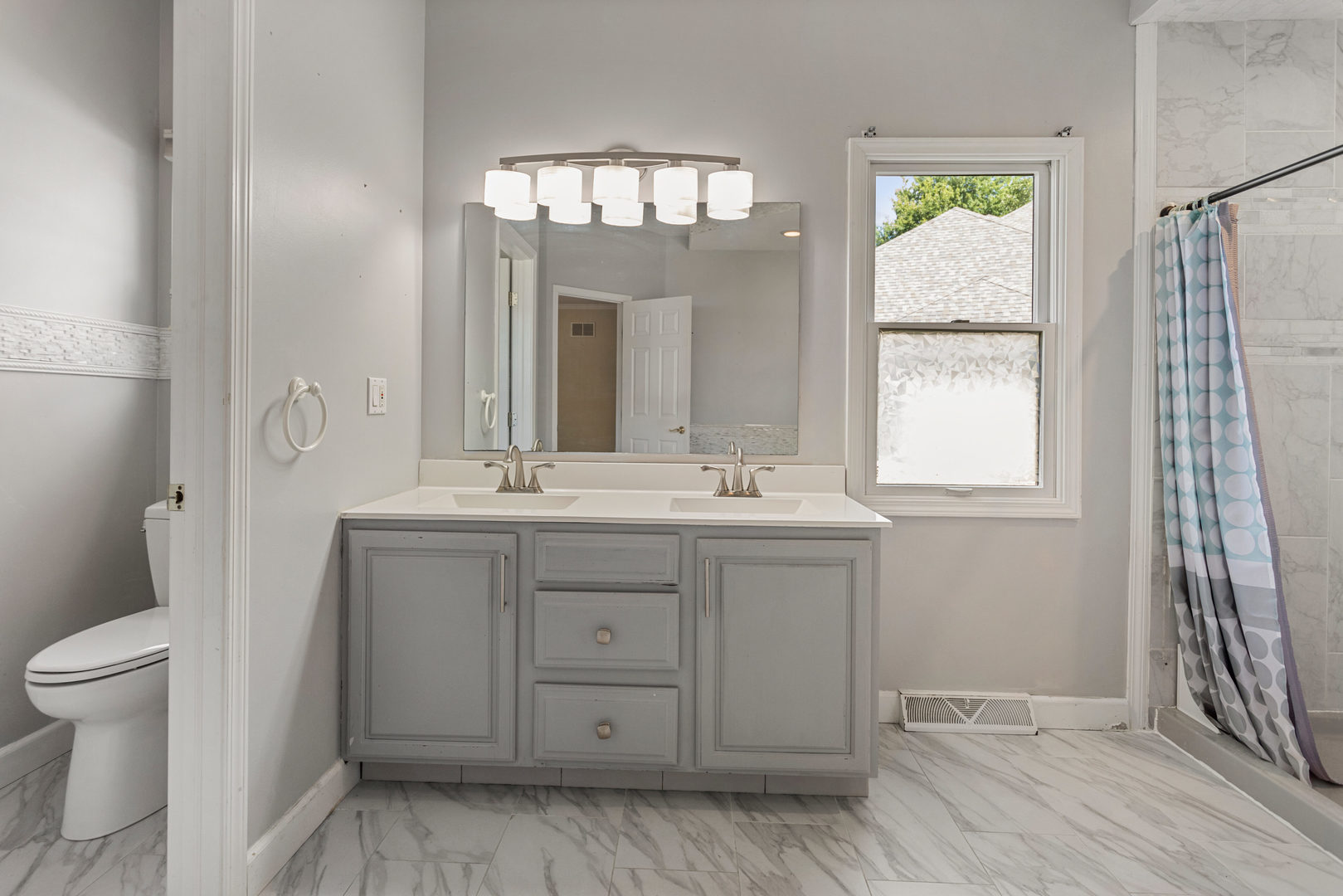 1511 River Bluff Court Mahomet, IL 61853 - Photo 18 of 50 a bathroom with a sink a toilet and a mirror