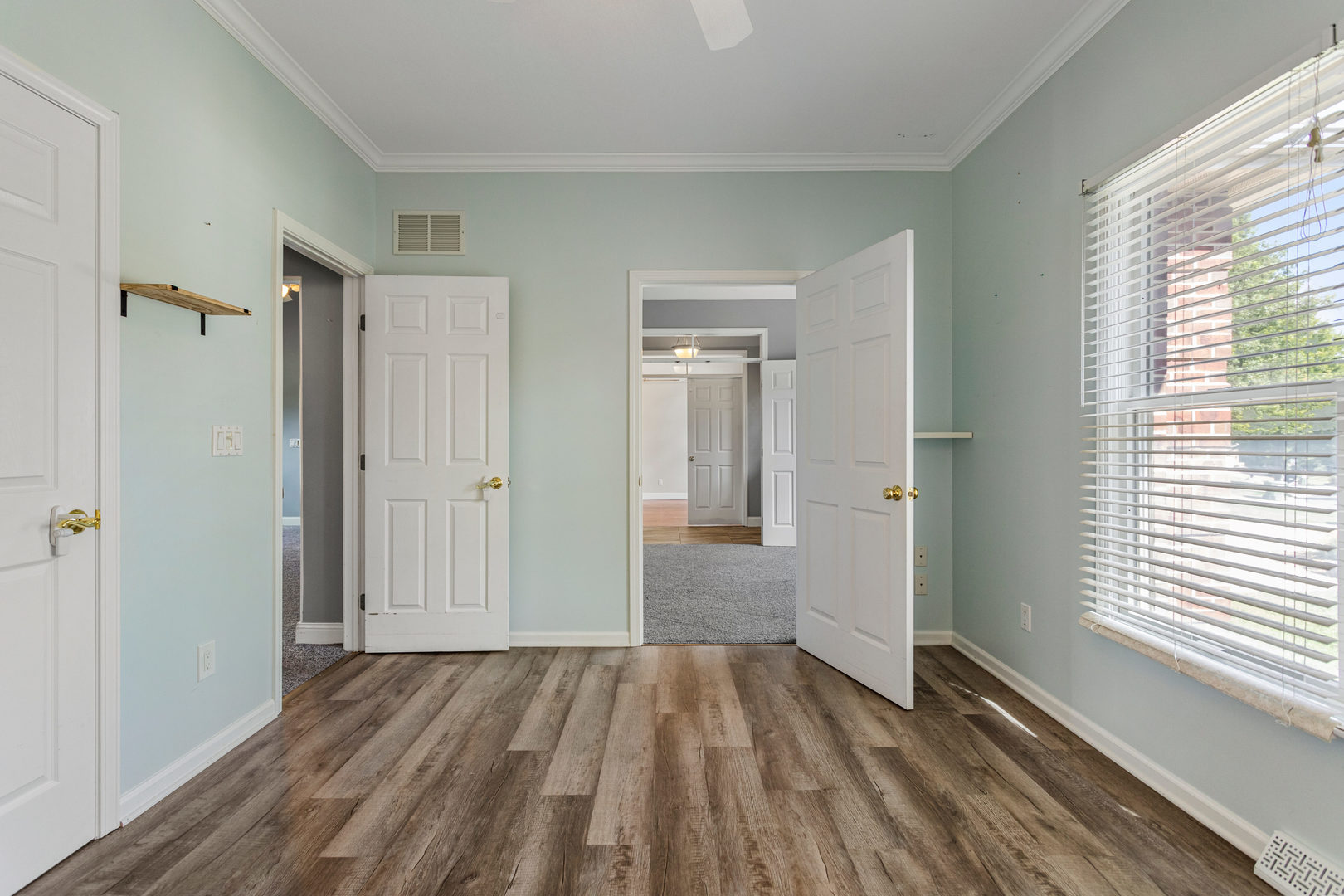 1511 River Bluff Court Mahomet, IL 61853 - Photo 24 of 50 a view of a room with wooden floor and a window