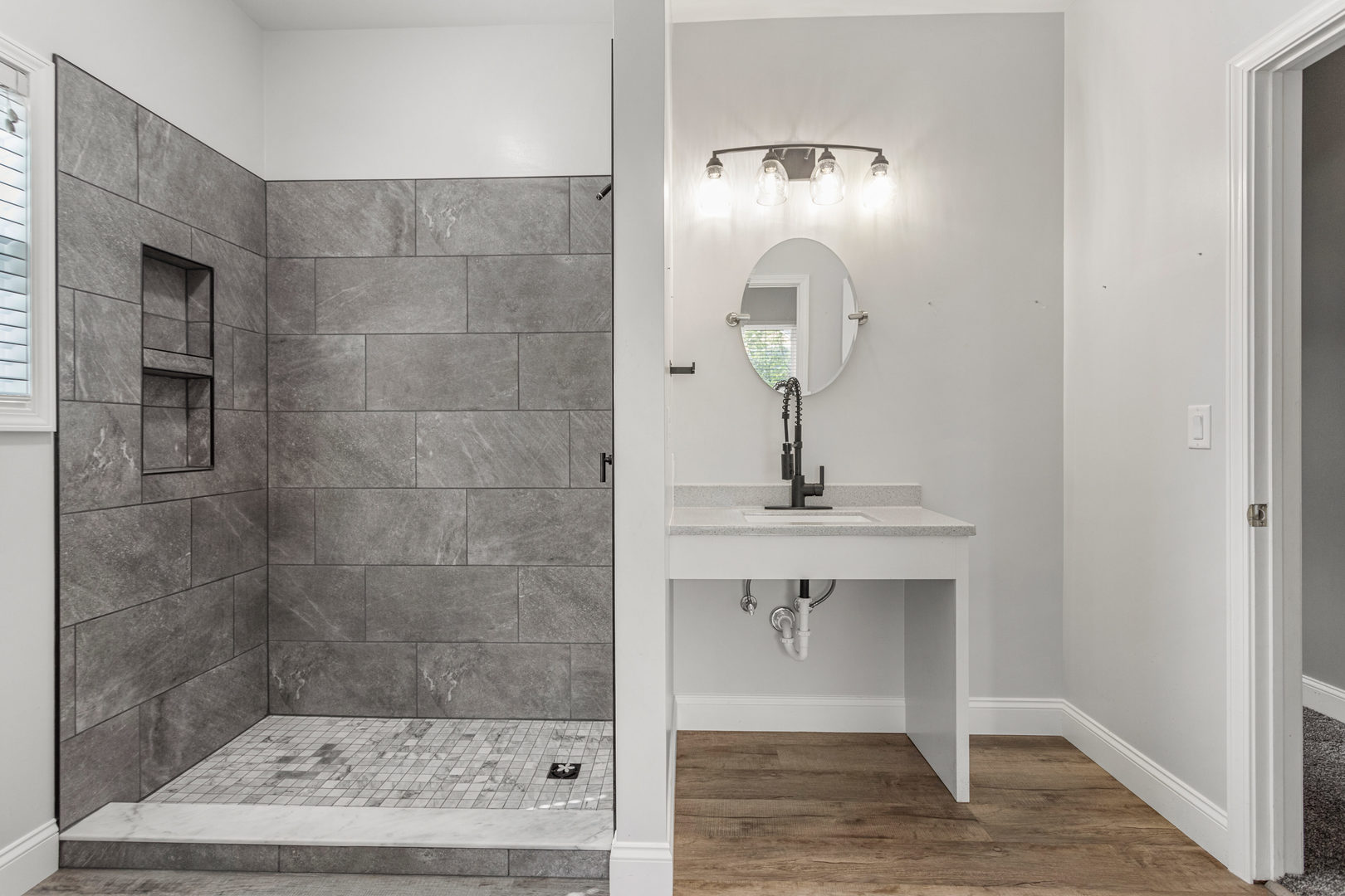 1511 River Bluff Court Mahomet, IL 61853 - Photo 25 of 50 a bathroom with a sink a light fixture and a glass door shower