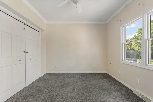 a big room with windows and closet