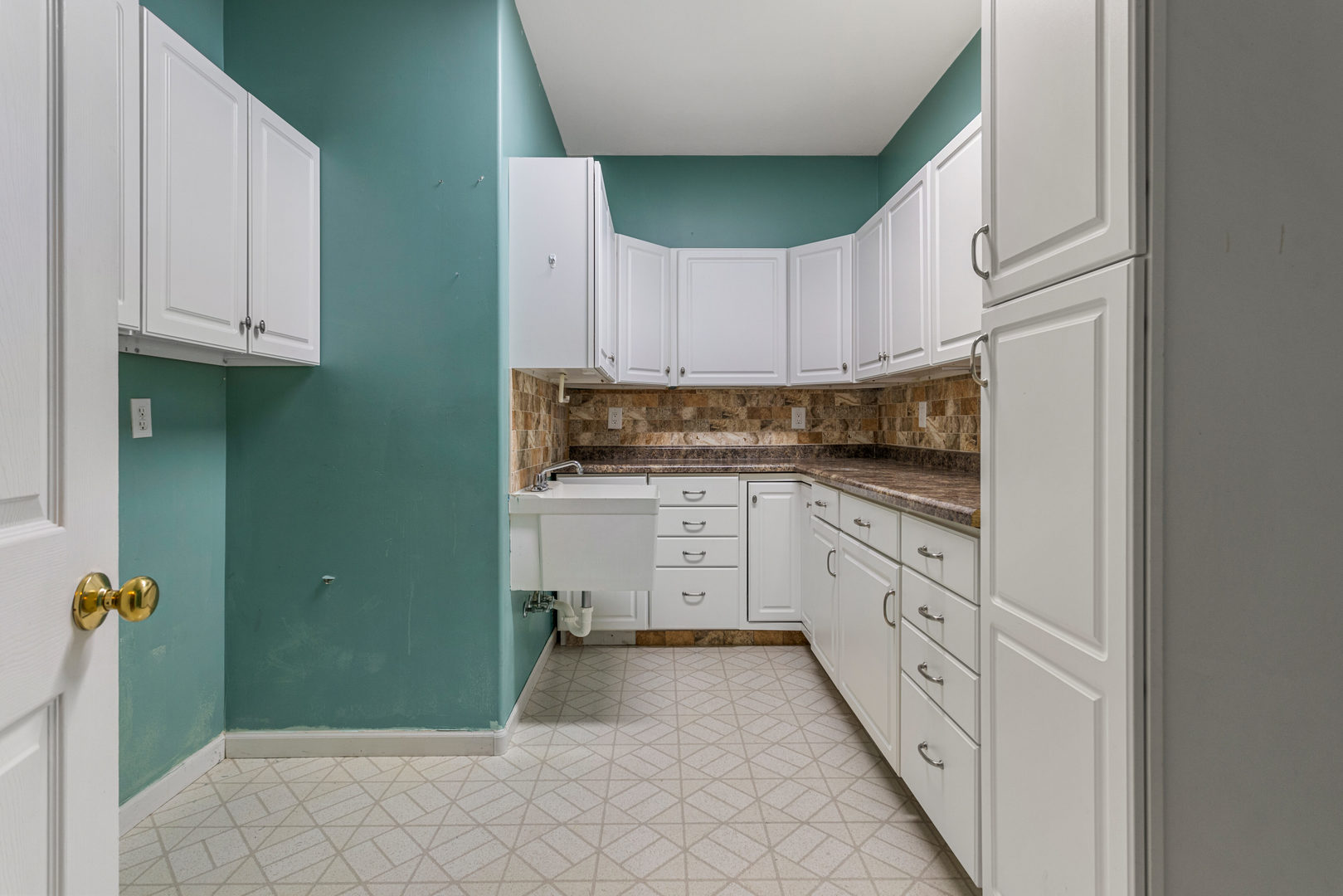 1511 River Bluff Court Mahomet, IL 61853 - Photo 30 of 50 a kitchen with granite countertop white cabinets and white appliances