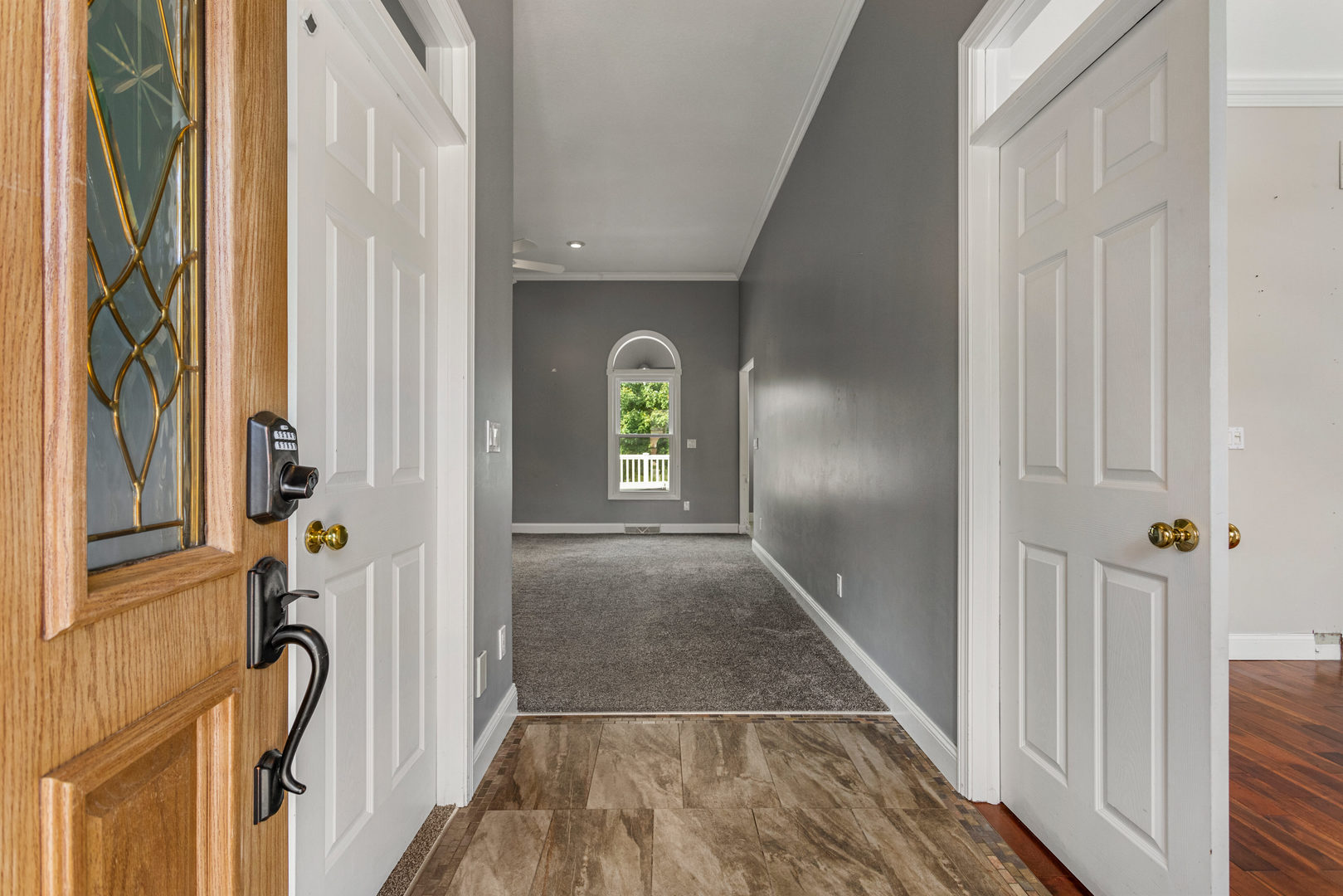 1511 River Bluff Court Mahomet, IL 61853 - Photo 4 of 50 a view of a hallway with wooden floor and staircase