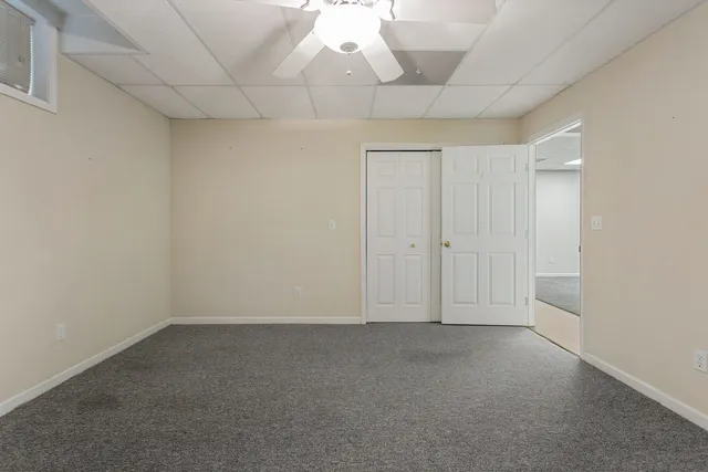 a view of a house with a yard and plants