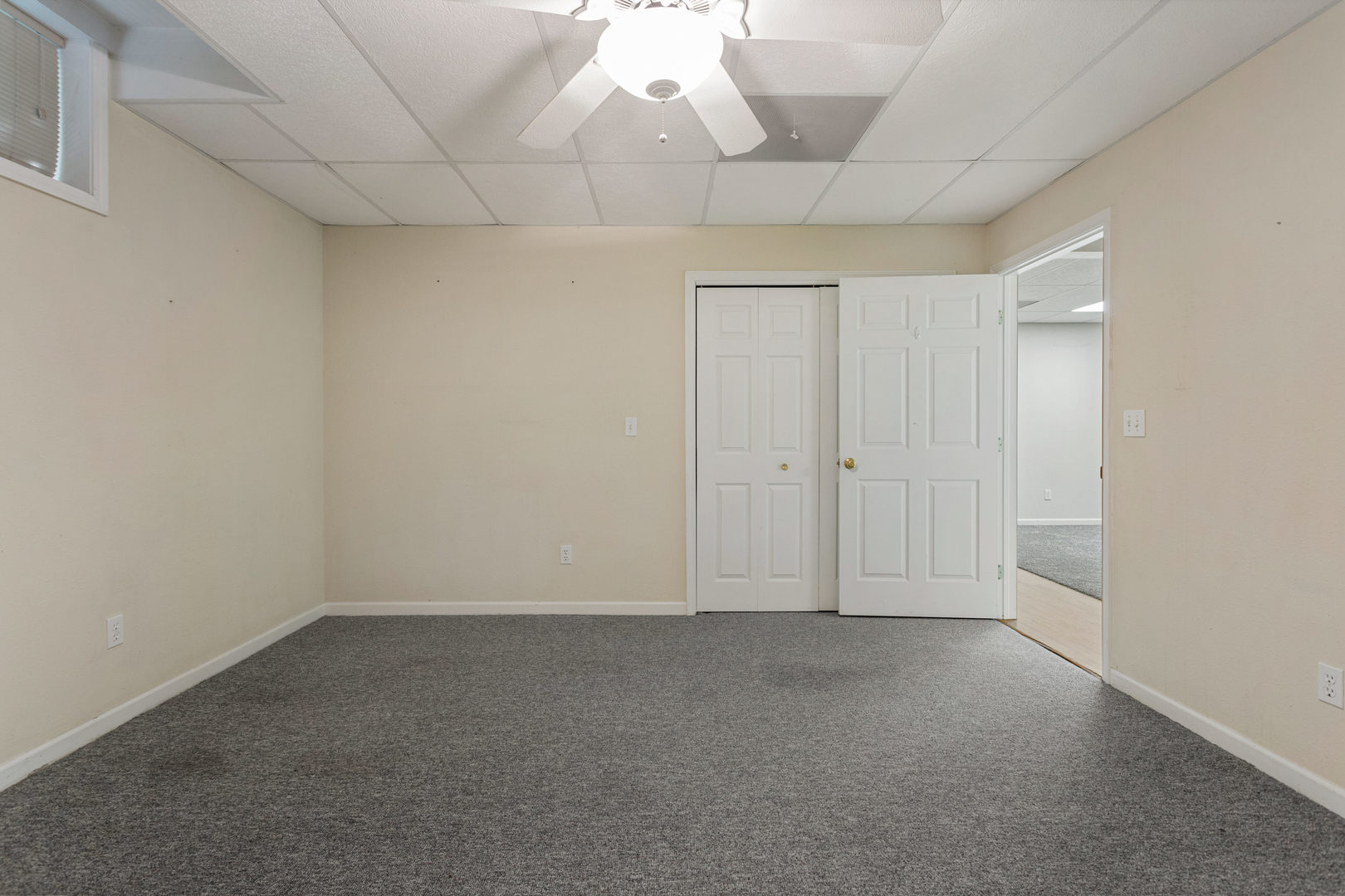 1511 River Bluff Court Mahomet, IL 61853 - Photo 42 of 50 an empty room with chandelier fan