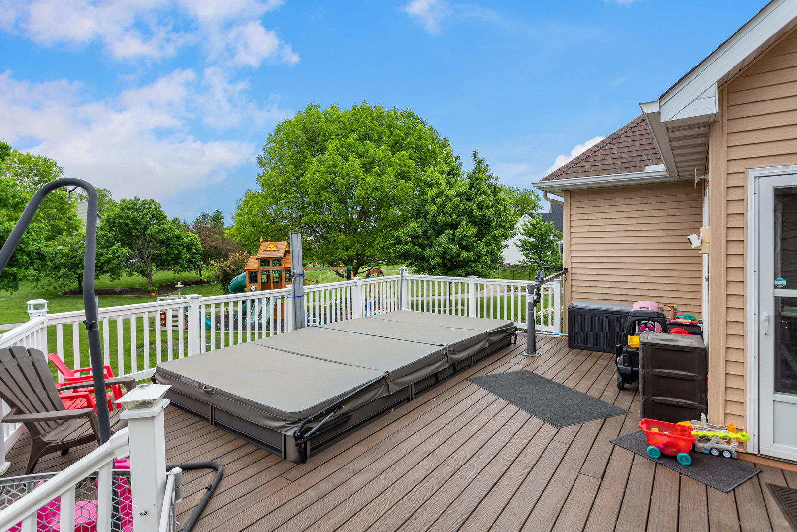 1511 River Bluff Court Mahomet, IL 61853 - Photo 46 of 50 a view of a roof deck with wooden floor and fence
