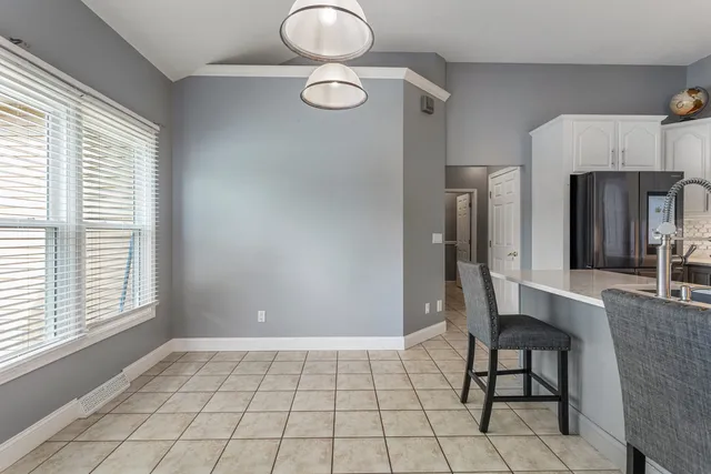 a view of kitchen with furniture and window
