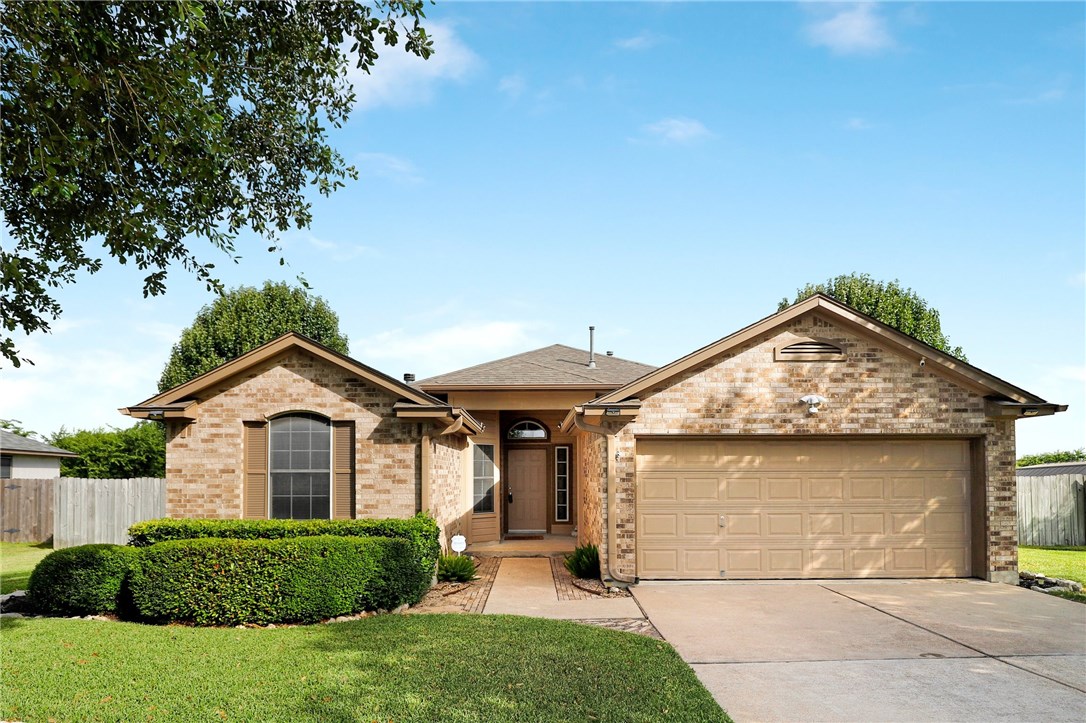 423 Little Lake Road Hutto, TX 78634 - Photo 1 of 1 a front view of a house with a yard and garage
