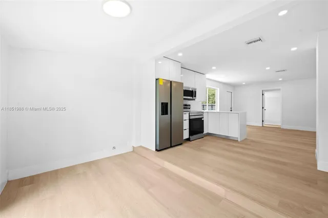a view of a kitchen with a sink