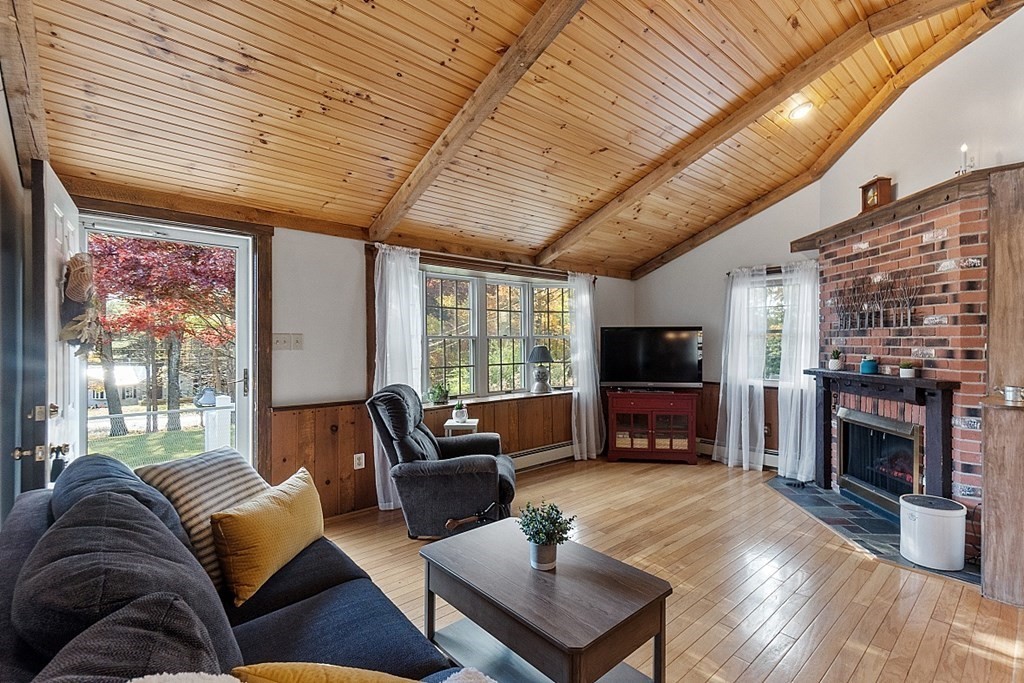 116 Partridgeville Road Templeton, MA 01468 - Photo 8 of 42 a living room with furniture flat screen tv and a fireplace