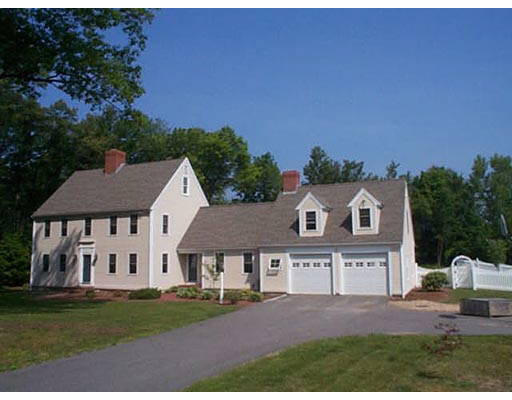 30 Kettle Hole Road Bolton, MA 01740 - Photo 1 of 6 a front view of a house with a garden and yard