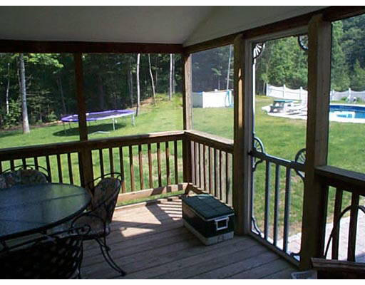 30 Kettle Hole Road Bolton, MA 01740 - Photo 3 of 6 a view of a chairs on wooden deck