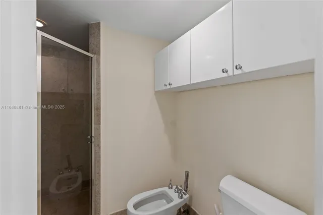 a bathroom with a tub a double vanity sink and a mirror