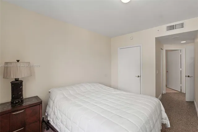 a bathroom with a toilet a sink and a mirror