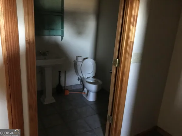 a bathroom with a toilet and a sink