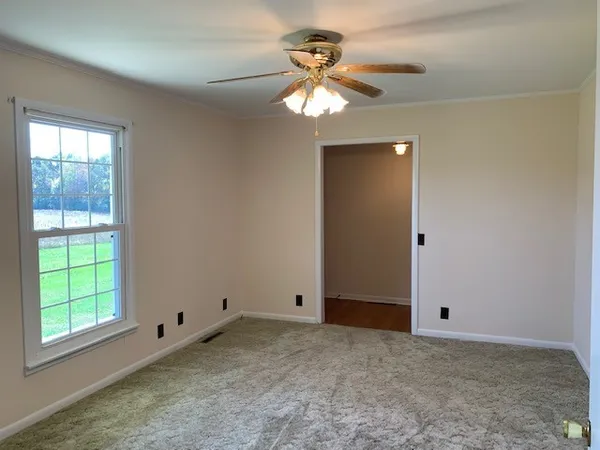 a view of an empty room with a window