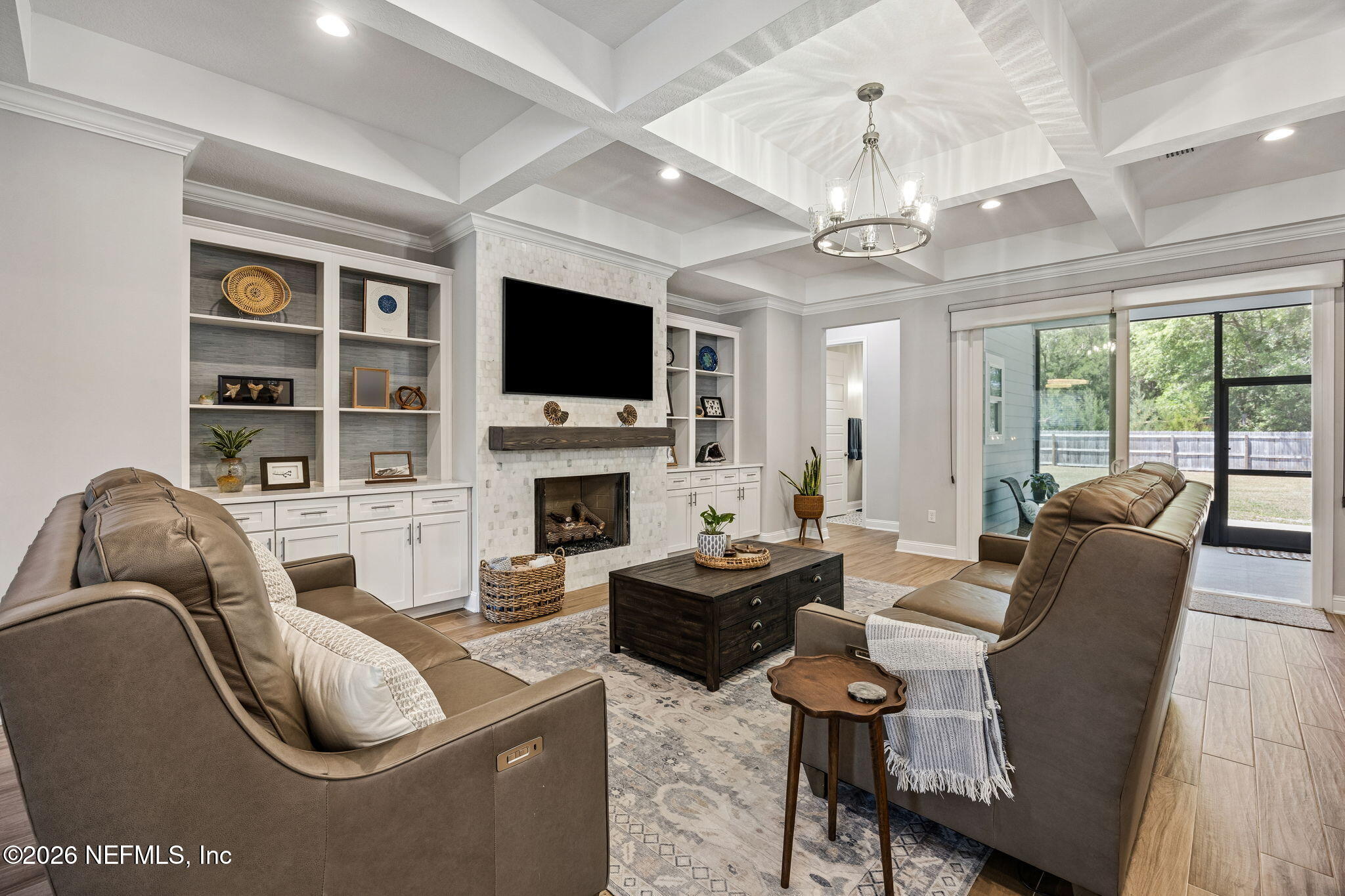 85949 Miner Pines Yulee, FL 32097 - Photo 14 of 55 a living room with furniture a fireplace and a flat screen tv
